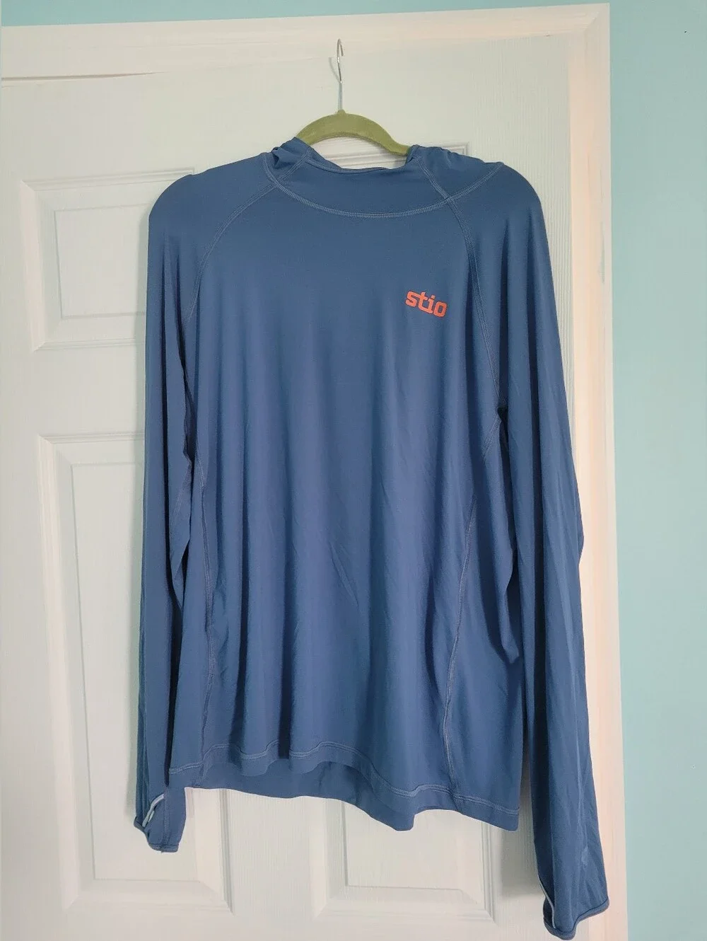 Stio Men's Long-Sleeve Hooded Top in Slate Blue with Coral Logo
